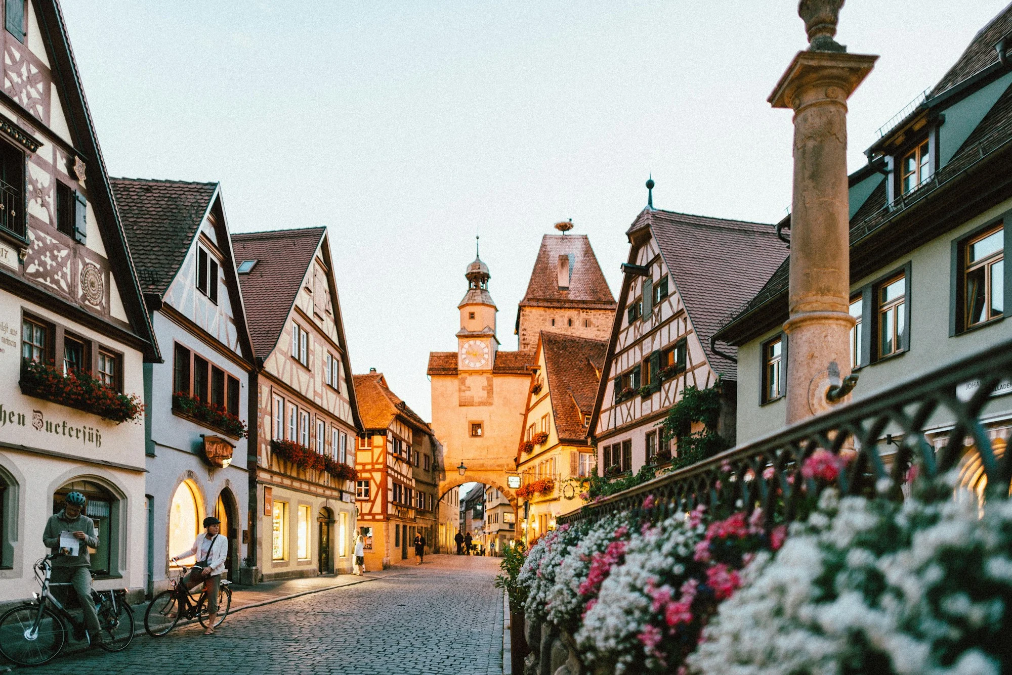 Narrow European old town street with warm evening light — AI planned Europe trip