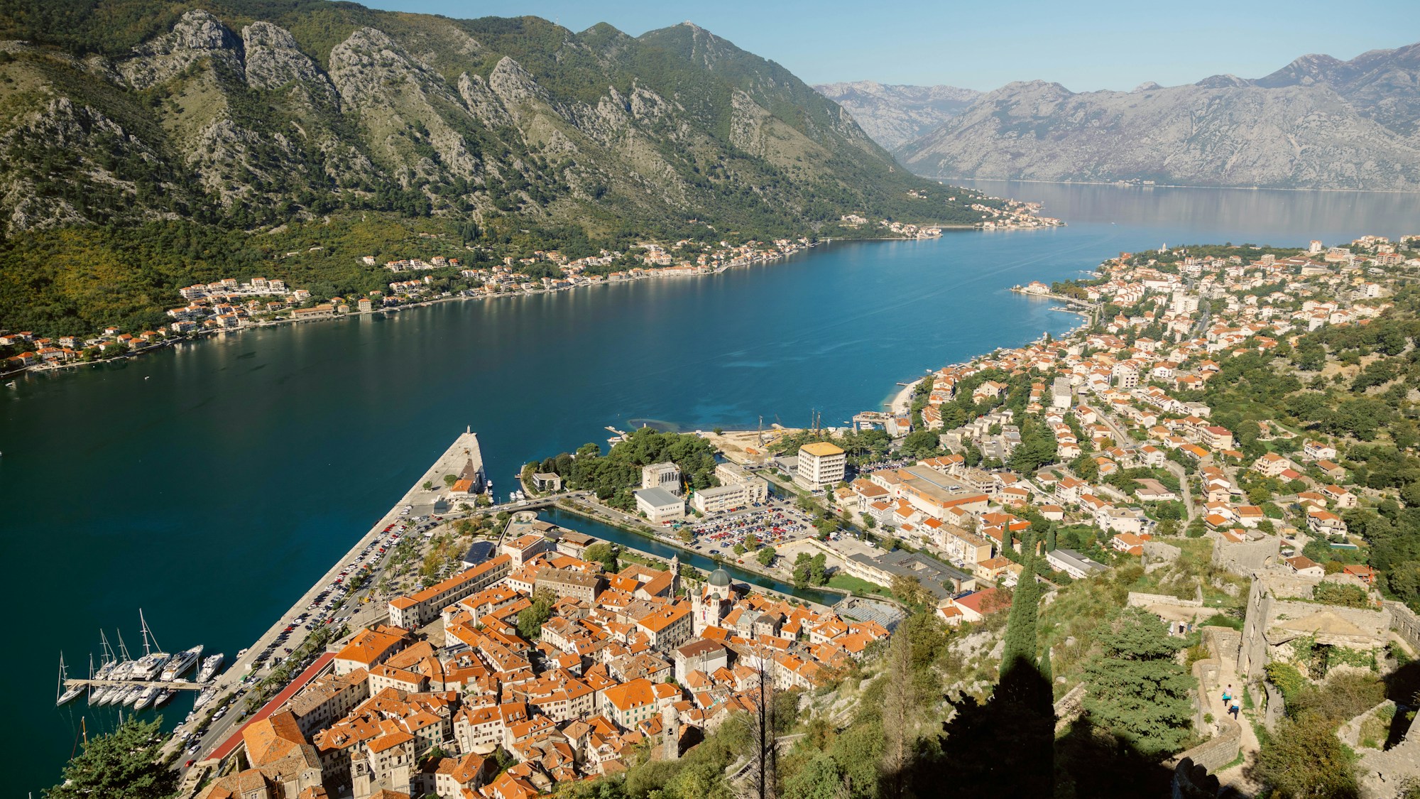 Lake Orta at golden hour with Isola di San Giulio reflected in still water