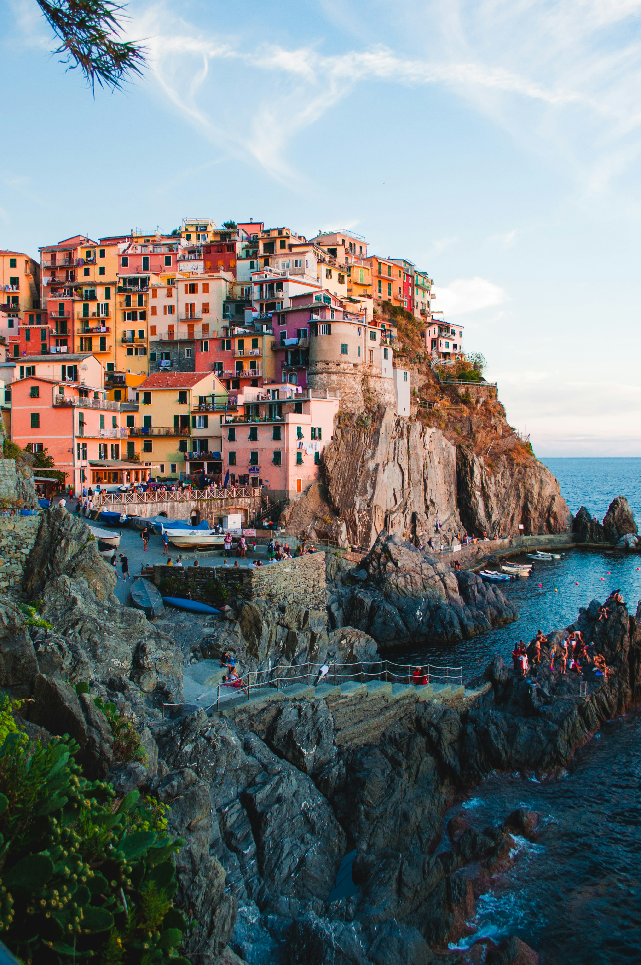Colorful Italian coastal buildings with blue Mediterranean Sea — Italy monthly budget guide