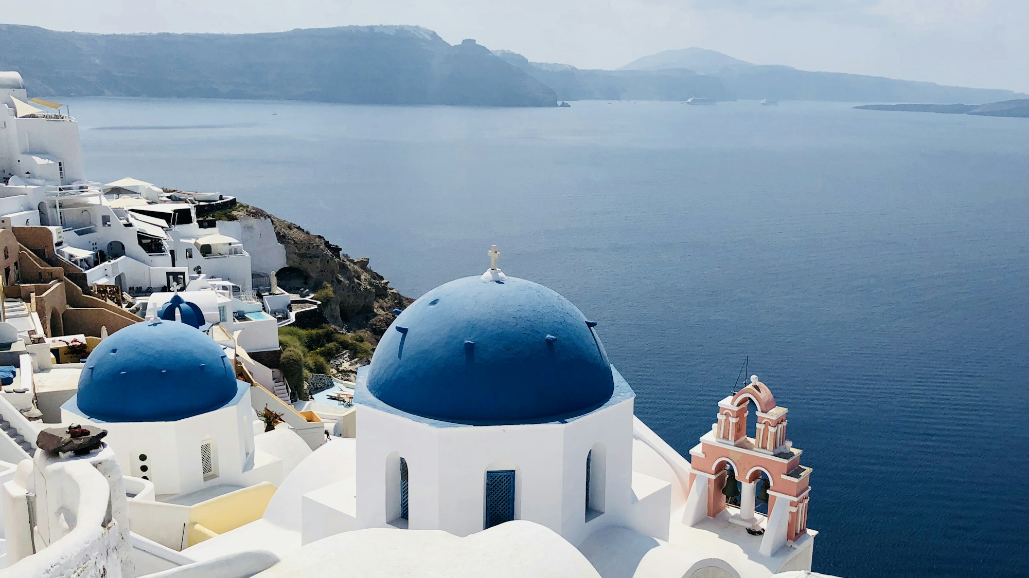 Santorini blue domes Greece - Greek islands cost guide